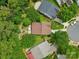 Aerial view of a well-maintained neighborhood with lush greenery and backyard patio at 1006 Washburn Ct, Monroe, NC 28110