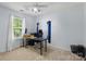 Light bedroom with a ceiling fan, a window, and a desk at 1006 Washburn Ct, Monroe, NC 28110