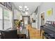 Open dining area features a stone table with black leather seating and opens to the kitchen at 1006 Washburn Ct, Monroe, NC 28110