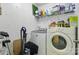Functional laundry room with modern washer and dryer and storage at 1006 Washburn Ct, Monroe, NC 28110