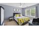 Cozy main bedroom with natural light, and a large bed at 1006 Washburn Ct, Monroe, NC 28110