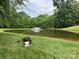 Scenic pond with a fountain, perfect for fishing and relaxing amidst the serene natural surroundings at 1006 Washburn Ct, Monroe, NC 28110