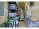 Storage room with shelving, water heater, and building supplies at 1006 Washburn Ct, Monroe, NC 28110