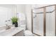 Bright bathroom featuring a glass shower and neutral color palette at 10901 Greenvale Dr, Harrisburg, NC 28075