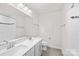 Bathroom featuring double sink vanity and shower with glass doors at 10901 Greenvale Dr, Harrisburg, NC 28075