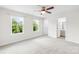 Light and airy bedroom with large windows and neutral carpeting at 10901 Greenvale Dr, Harrisburg, NC 28075