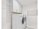 Functional laundry room with washer, dryer, and storage cabinets at 10901 Greenvale Dr, Harrisburg, NC 28075