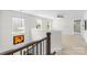 Bright loft area with carpet, a ceiling fan, and views of the outdoor landscape at 10901 Greenvale Dr, Harrisburg, NC 28075