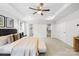 Spacious main bedroom with tray ceiling, plush carpet, and dual walk-in closets at 10901 Greenvale Dr, Harrisburg, NC 28075