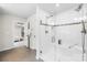 Modern shower with glass enclosure, tile surround, and built-in seating at 10901 Greenvale Dr, Harrisburg, NC 28075