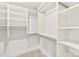 Spacious walk-in closet with built-in shelving and ample storage space at 10901 Greenvale Dr, Harrisburg, NC 28075