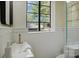 Bright bathroom featuring a unique sink, gold fixtures, and wainscoting at 1121 Myrtle Ave # 72, Charlotte, NC 28203