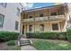 Exterior of a well maintained building with a private balcony, and landscaping at 1121 Myrtle Ave # 72, Charlotte, NC 28203