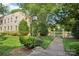 Beautiful building exterior with manicured landscaping, trees, and charming entrance with decorative elements at 1121 Myrtle Ave # 72, Charlotte, NC 28203