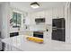 Bright kitchen featuring white cabinets, modern appliances, quartz countertops, and a black Galanz refrigerator at 1121 Myrtle Ave # 72, Charlotte, NC 28203