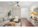 Spacious living area with hardwood floors, neutral tones and ceiling fan at 1121 Myrtle Ave # 72, Charlotte, NC 28203