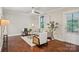 Cozy living room boasts hardwood floors, neutral-toned furniture, natural light, and stylish decor at 1121 Myrtle Ave # 72, Charlotte, NC 28203