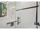 Modern tiled shower with a glass door, matte black hardware, and a niche at 1121 Myrtle Ave # 72, Charlotte, NC 28203