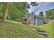 Backyard featuring a patio area, fire pit, and lush greenery at 11619 Rimrock Canyon Dr, Charlotte, NC 28226
