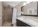 Updated bathroom featuring a tiled shower, large mirror, and modern vanity at 11619 Rimrock Canyon Dr, Charlotte, NC 28226