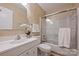 Bathroom with glass door shower/tub combination and classic vanity at 11619 Rimrock Canyon Dr, Charlotte, NC 28226