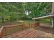 Spacious wooden deck overlooking a lush backyard with mature trees at 11619 Rimrock Canyon Dr, Charlotte, NC 28226