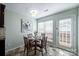 Sunlit dining area featuring wood floors and a modern light fixture at 11619 Rimrock Canyon Dr, Charlotte, NC 28226