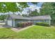 Charming single-story home features a well-maintained lawn and attached one car garage at 11619 Rimrock Canyon Dr, Charlotte, NC 28226