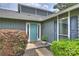 Inviting entryway with vibrant door and manicured landscaping at 11619 Rimrock Canyon Dr, Charlotte, NC 28226
