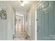 Hallway with tile flooring, leading to the rest of the home at 11619 Rimrock Canyon Dr, Charlotte, NC 28226