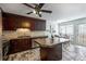 Eat-in kitchen with stainless appliances, granite countertops, and stylish tile flooring at 11619 Rimrock Canyon Dr, Charlotte, NC 28226