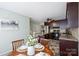 Open kitchen offers stainless steel appliances, dark cabinets, and a cozy breakfast nook at 11619 Rimrock Canyon Dr, Charlotte, NC 28226