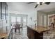Sunlit kitchen features a breakfast nook with island, stone floors, and stainless appliances at 11619 Rimrock Canyon Dr, Charlotte, NC 28226