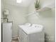 Functional laundry area with washer, dryer, and storage shelf at 11619 Rimrock Canyon Dr, Charlotte, NC 28226