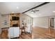 Bright living room featuring hardwood floors, stone fireplace, and exposed beams at 11619 Rimrock Canyon Dr, Charlotte, NC 28226