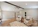 Open living room boasts beautiful hardwood floors, a ceiling fan, and neutral-toned walls at 11619 Rimrock Canyon Dr, Charlotte, NC 28226