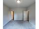 Spacious bedroom showcasing neutral walls and plush gray carpeting at 1312 7Th St, Statesville, NC 28677