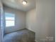 Cozy bedroom with neutral paint, carpet, large window, and ample natural light at 1312 7Th St, Statesville, NC 28677