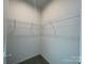 Walk-in closet offering ample storage with wire shelving and gray carpeting at 1312 7Th St, Statesville, NC 28677
