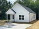 Charming single-Gathering home showcasing a well-manicured lawn and concrete driveway at 1312 7Th St, Statesville, NC 28677