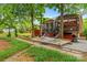 Backyard with a hammock chair, lush green grass, and a grill at 149 Harbor Landing Dr, Mooresville, NC 28117