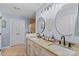 Elegant bathroom with double vanity sinks, granite countertops, and modern fixtures at 149 Harbor Landing Dr, Mooresville, NC 28117