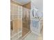 Stylish bathroom featuring a glass-enclosed shower with tile surround and double vanity at 149 Harbor Landing Dr, Mooresville, NC 28117