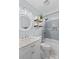 Modern bathroom with a marble vanity, round mirror, and a tiled shower with bathtub at 149 Harbor Landing Dr, Mooresville, NC 28117