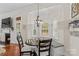 Charming breakfast nook with bright windows, built-in bench, and modern chandelier lighting at 149 Harbor Landing Dr, Mooresville, NC 28117