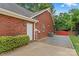 Brick home featuring a side entry door, and a well-maintained yard with stone walkway at 149 Harbor Landing Dr, Mooresville, NC 28117