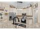 Bright kitchen featuring stainless steel appliances, granite countertops, and custom cabinetry at 149 Harbor Landing Dr, Mooresville, NC 28117