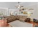 Large living room with hardwood floors, fireplace, and a comfortable sectional sofa at 149 Harbor Landing Dr, Mooresville, NC 28117