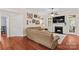 Comfortable living room with a fireplace, hardwood floors, and lots of natural light at 149 Harbor Landing Dr, Mooresville, NC 28117