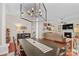 Open-concept living space with fireplace, wood floors, and access to dining area at 149 Harbor Landing Dr, Mooresville, NC 28117